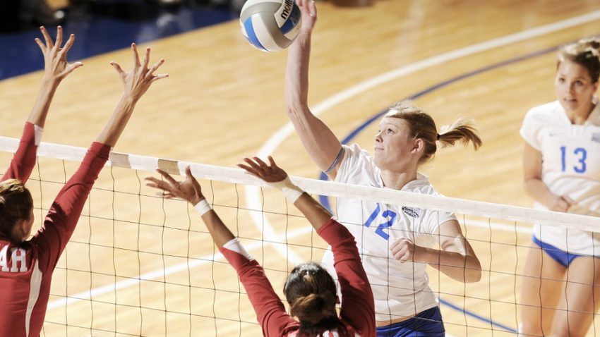 two women block the ball